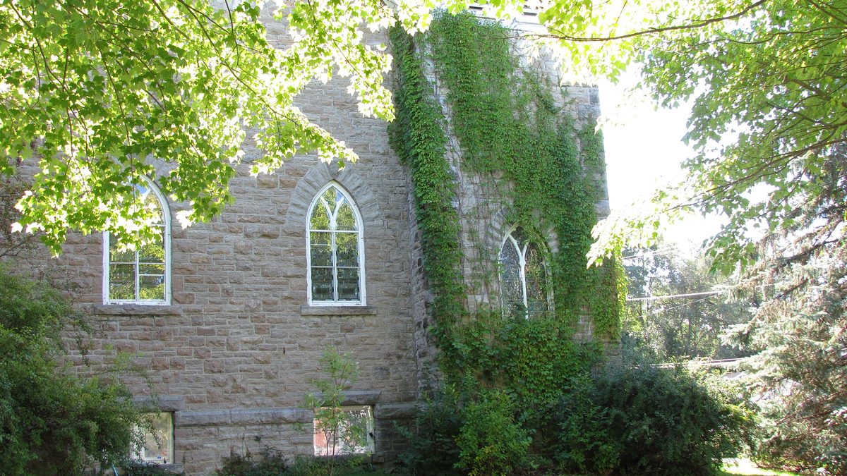 Manotick United Church, a limestone church with pointed-arch windows on Manotick Main Street
